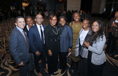 Anne Robinson and Dean Abebe surrounded by guests